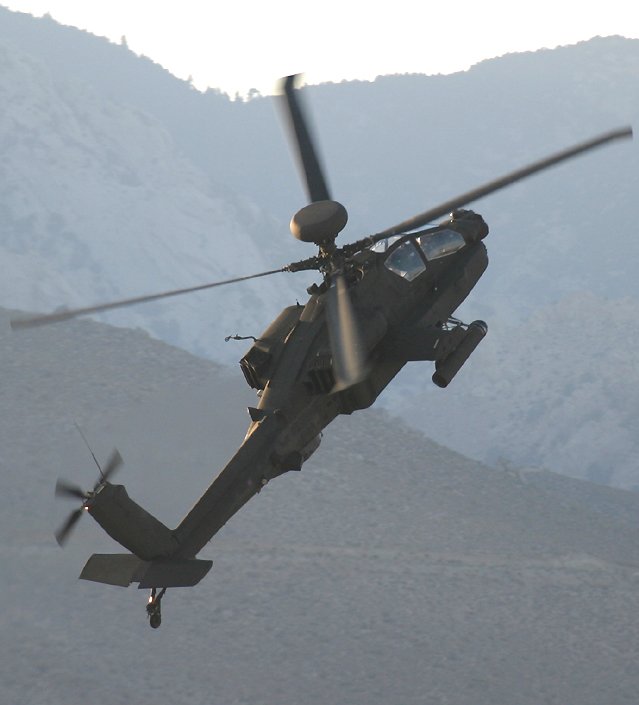 Apache helicopter doing a steep climb