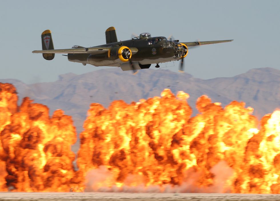 B-25 Mitchell with the Wall of Fire   (click here to open a new window with this photo in computer wallpaper format)