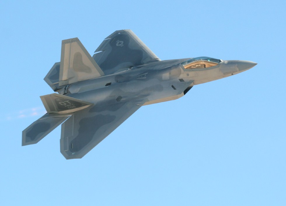 F-22 Raptor banking   (click here to open a new window with this photo in computer wallpaper format)