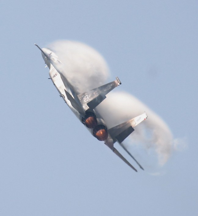 F-15 Eagle pulling vapor with afterburners in action