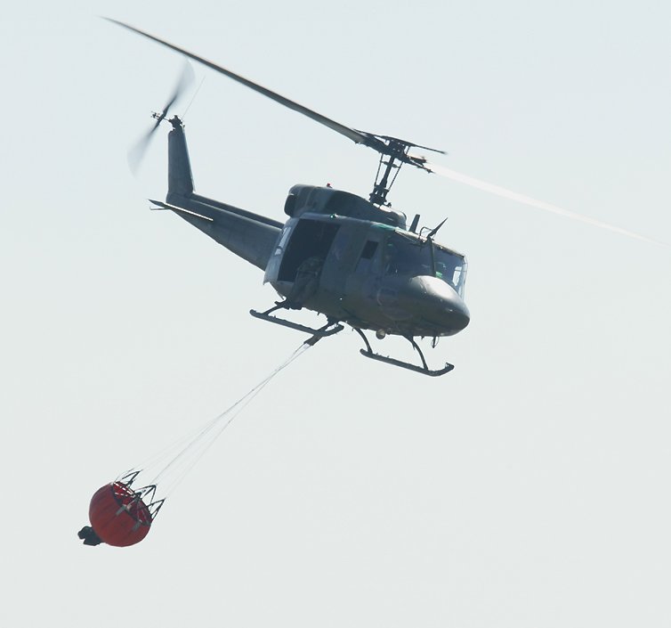 UH-1 Huey with water bucket for fire fighting