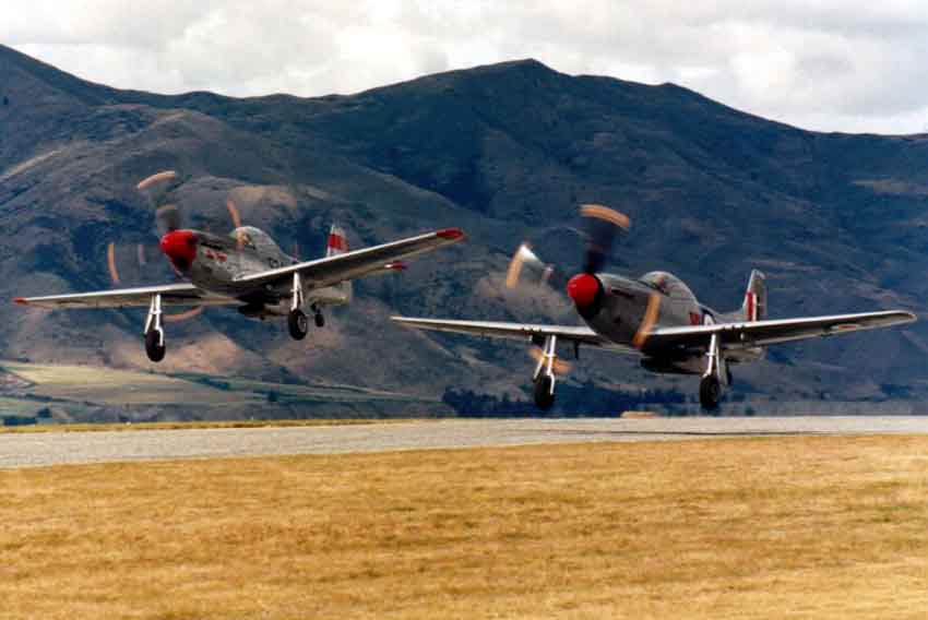 Two P51 Mustangs taking off