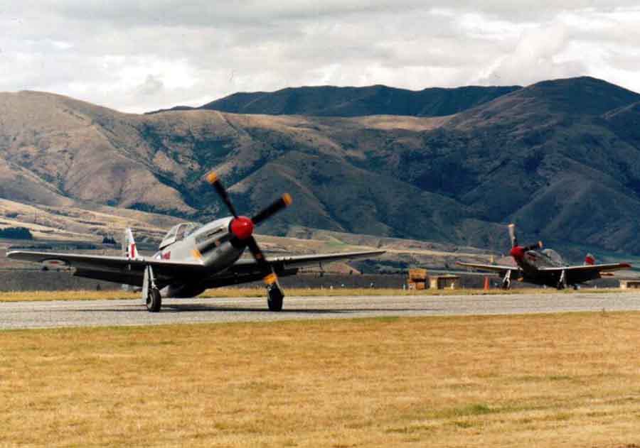 Two P51 Mustangs taxying