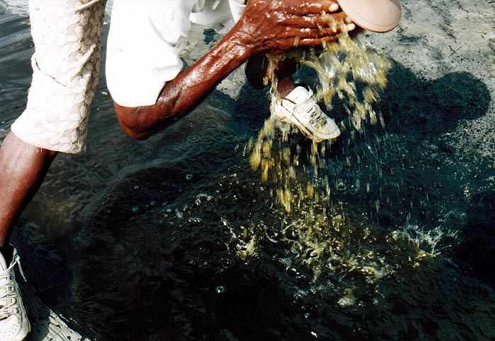 Roy washing his face in a mineral water filled ditch on the lake
