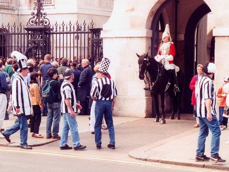 soccer fans and mounted guardsman   (click here to open a new window with this photo in computer wallpaper format)