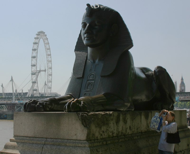 A sphinx on the Embankment with the London Eye across the river
