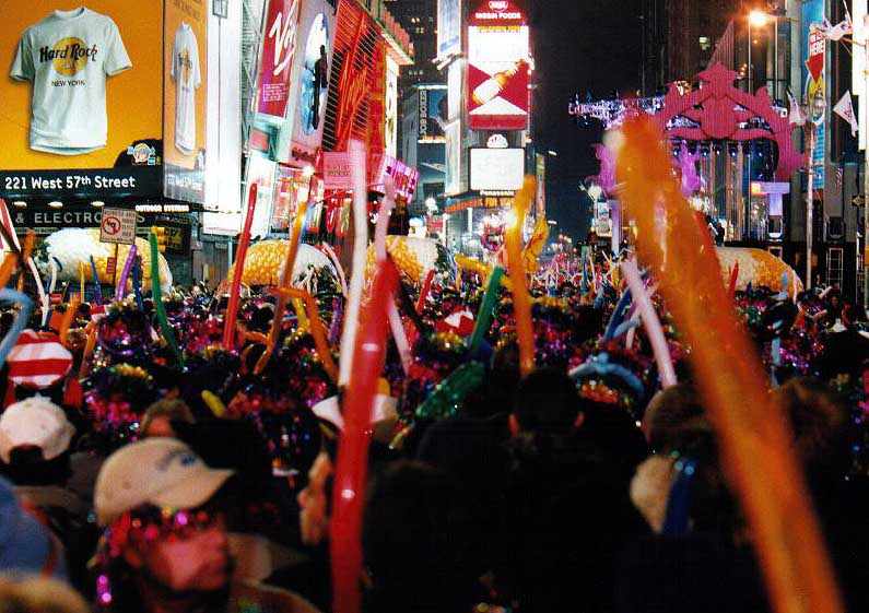 crowd with balloons and tinsel wigs (65K)