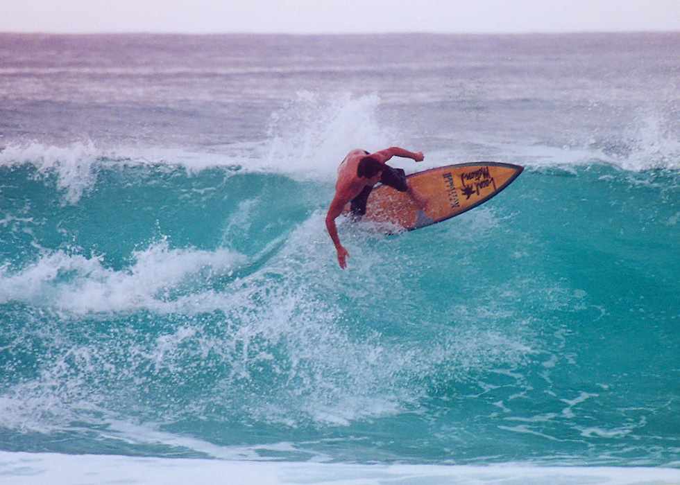surfer leaning over horizontally