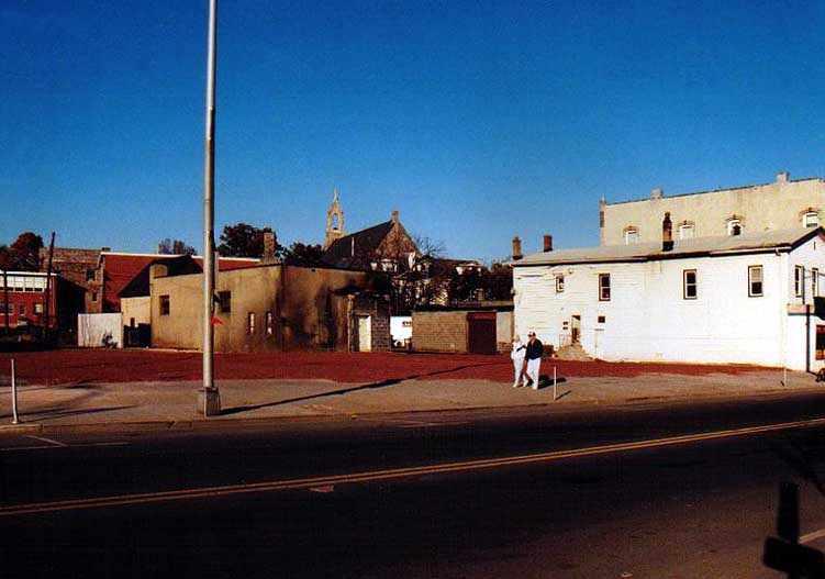 vacant lot where the burned-out stores used to be