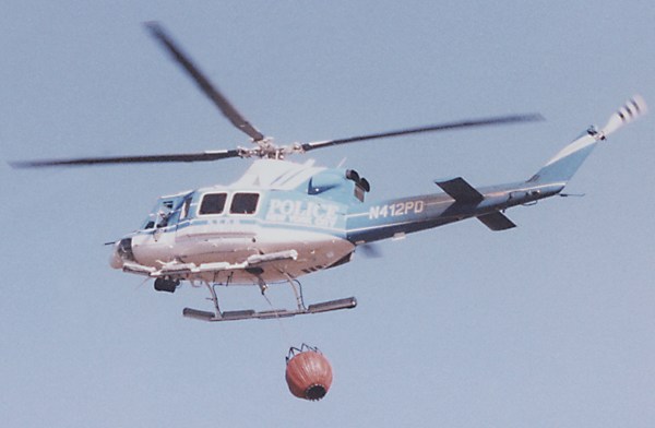 NYPD helicopter with monsoon bucket