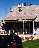 guys watching proceedings from roof of a house