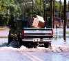 truck driving down flooded Canal Road