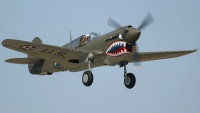 P40 Warhawk photographed at the Oshkosh AirVenture 2002 airshow using a Canon D60 digital camera and Canon 100-400mm lens