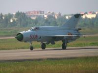 Vietnamese Air Force MiG 21 photographed at Danang airport in December of 2004 using a Canon 10D digital camera and Canon 100-400mm image stabilized lens set to 400mm  (1/1000th second, f5.6, ISO 100)