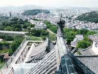 photograph of the grounds and surrounding area of Himeji Castle, taken from the roof in September of 2002 using a Pentax 35mm camera